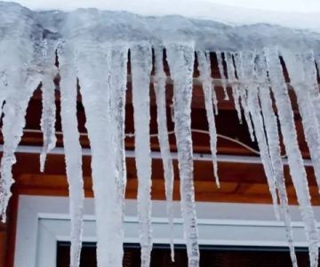 How to Maintain Roof Valleys and Downspouts to Prevent Ice Dams