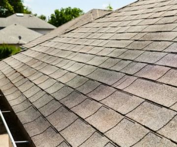 The Cost of a New Roof with Enhanced Algae Resistance Warranty