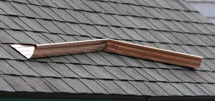 How to Install a Roof Saddle to Divert Water on a Flat Roof