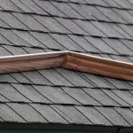How to Install a Roof Saddle to Divert Water on a Flat Roof