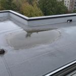 Ponding Water on a Low-Slope Roof: What to Check