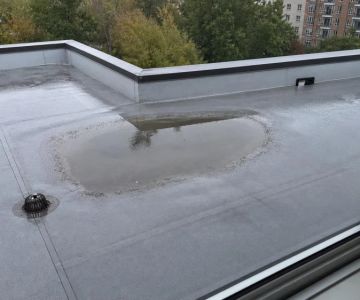 Ponding Water on a Low-Slope Roof: What to Check