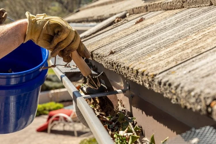 How to Clean Gutters on a Two-Story House Safely Without a Ladder